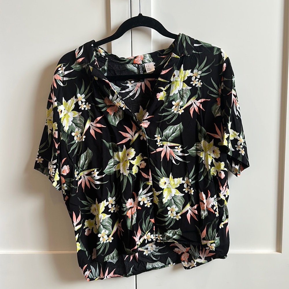 Light weight black Hawaiian shirt with floral pattern.
